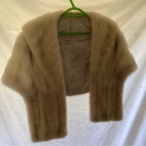Faux fur shawl , white with grey strips in it . Soft and pretty